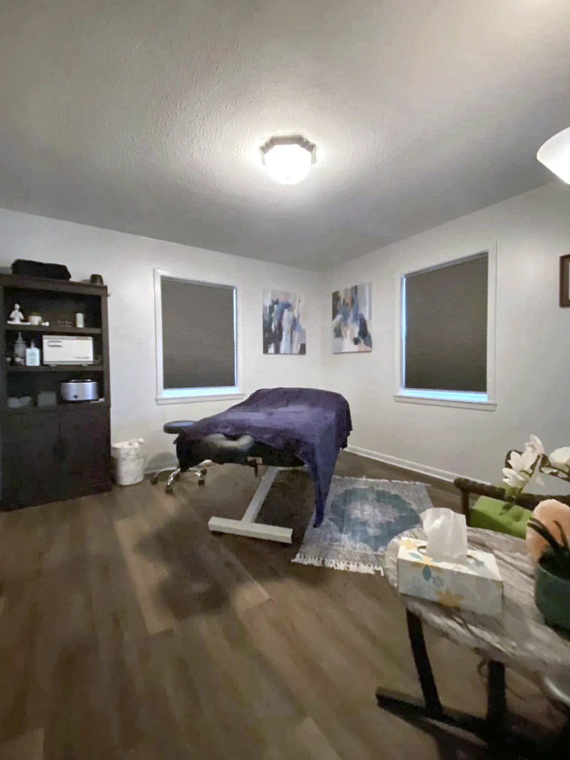 Treatment room with a padded therapy table